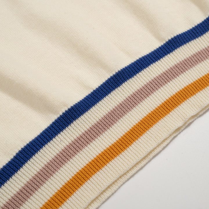 Polo masculino de malha Mod Cream dos anos 60 – acabamento com pontas multicoloridas