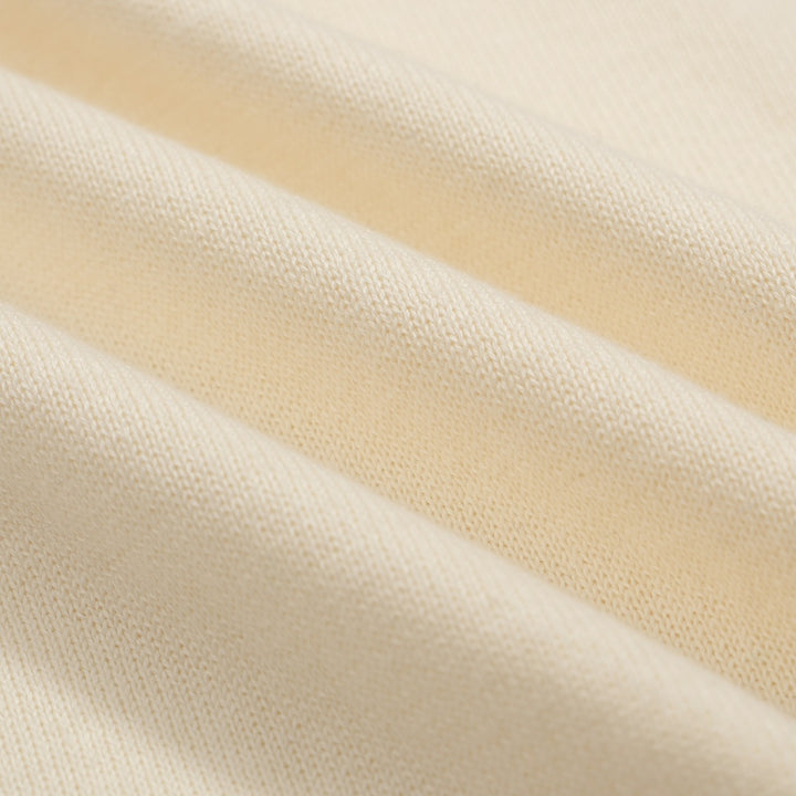 Polo masculino de malha Mod Cream dos anos 60 – acabamento com pontas multicoloridas