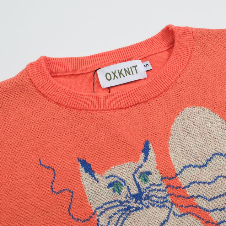 Camiseta feminina de malha jacquard gatinho laranja com comprimento cortado desenhado por Agathe Singer