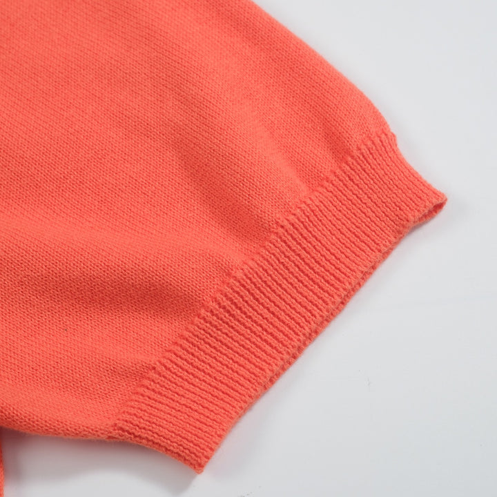 Camiseta feminina de malha jacquard gatinho laranja com comprimento cortado desenhado por Agathe Singer