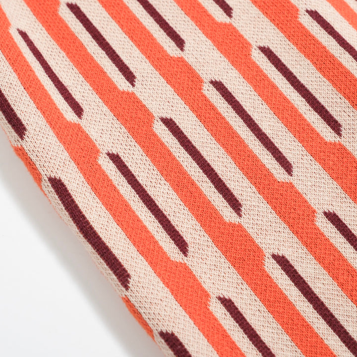 Herren-Poloshirt aus 70er-Jahre-Mod-Jacquard-Strick – vertikales Dash-Hemd in gebranntem Orange