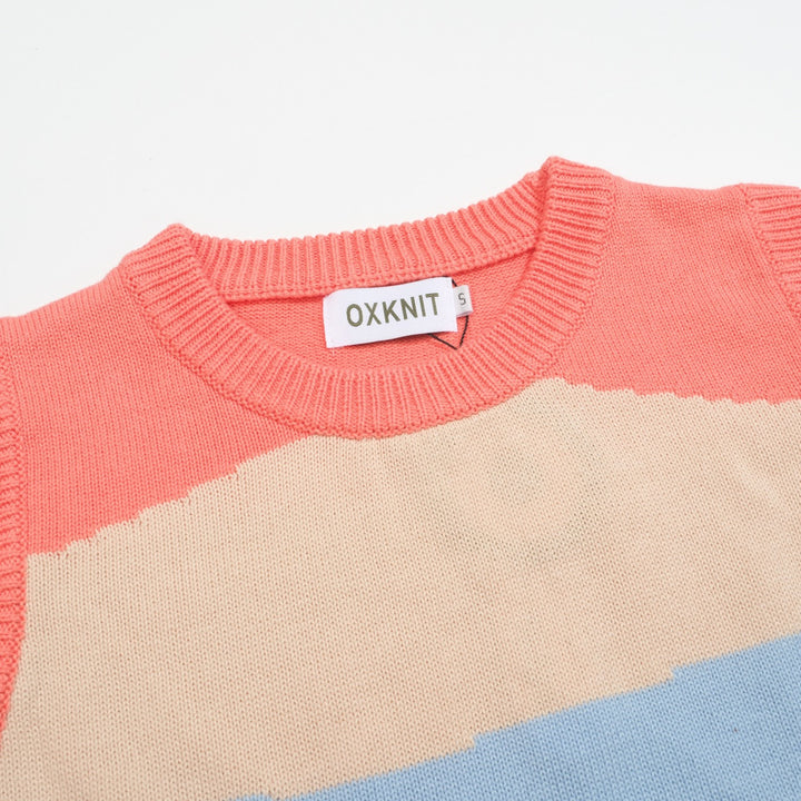 Kvinders retro-farveblokstrikkesæt med bløde pasteller i pink, blå og creme