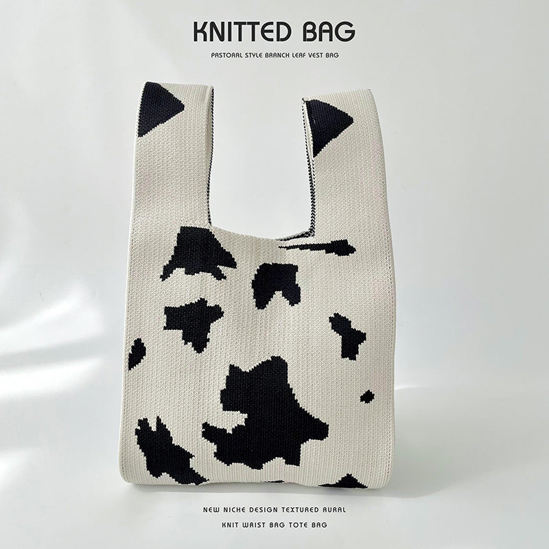 Gefleckte gestrickte Schultertasche