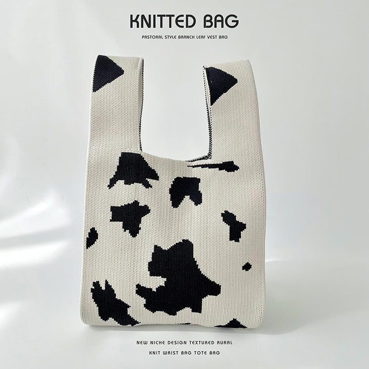Gefleckte gestrickte Schultertasche
