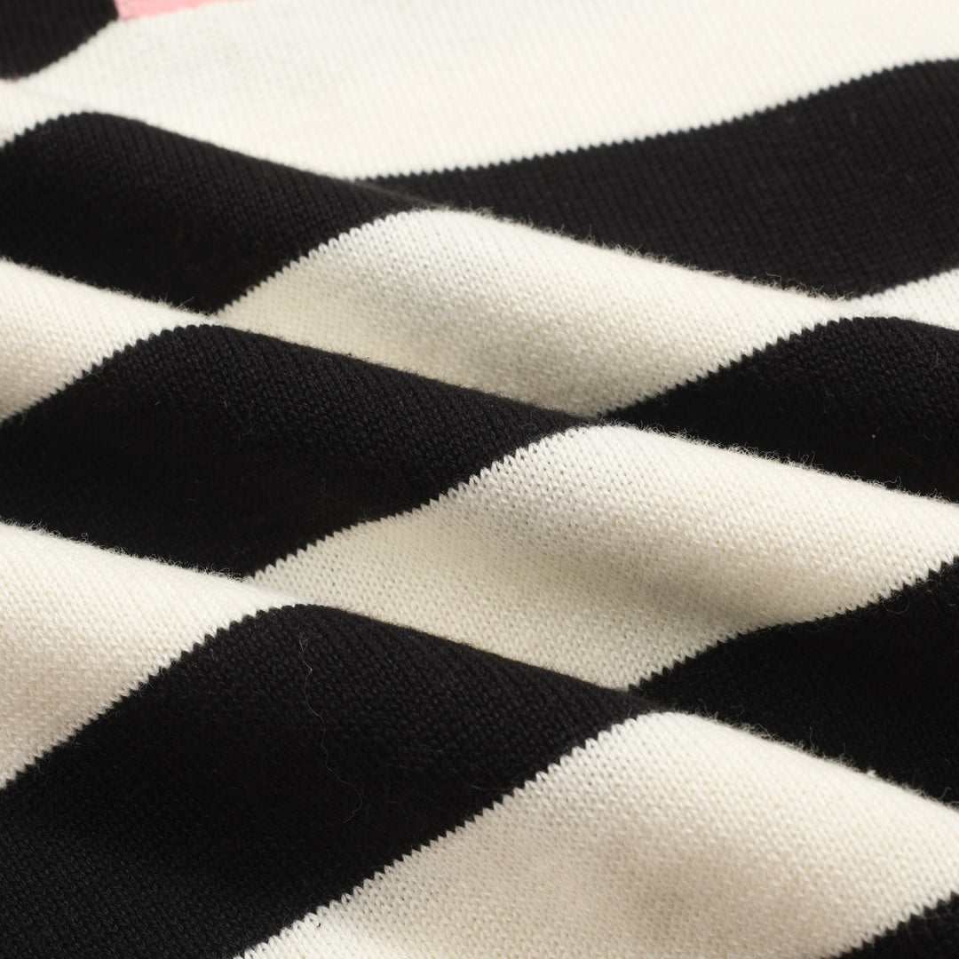 Polo de mujer de punto a rayas negro con manga burbuja