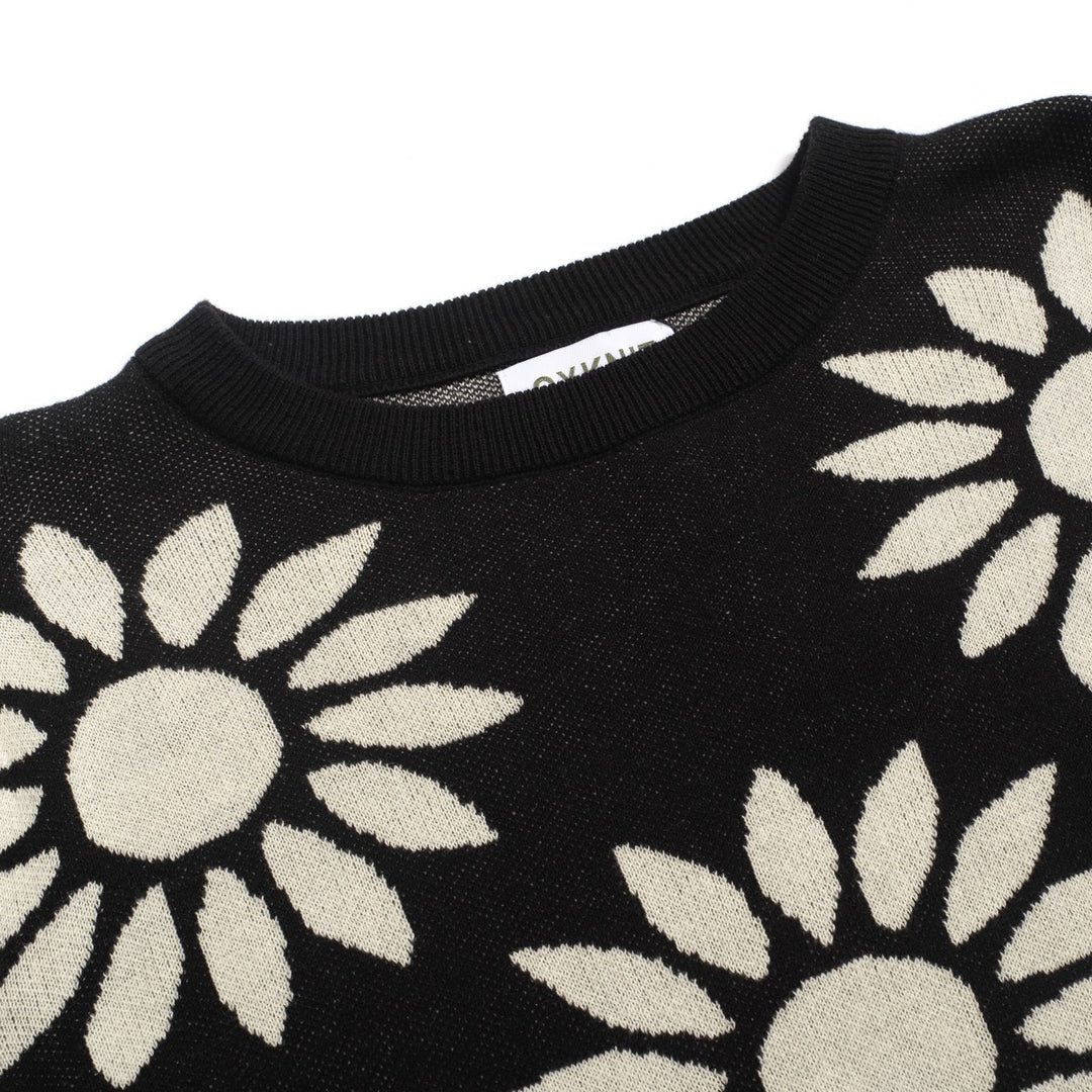 Kvinnors stickade plagg med puffärm i svart solrosjacquard
