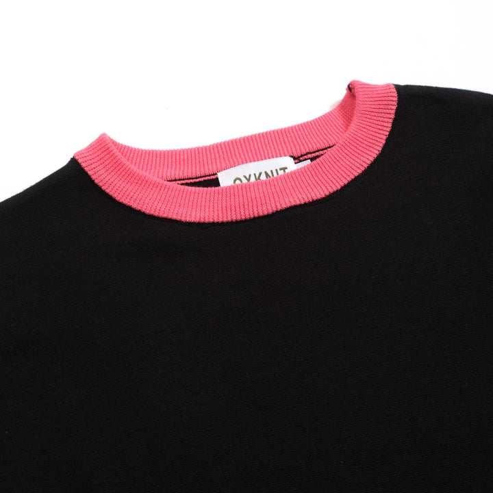 Kvinnors svarta stickade plagg i jacquard bubbelärm