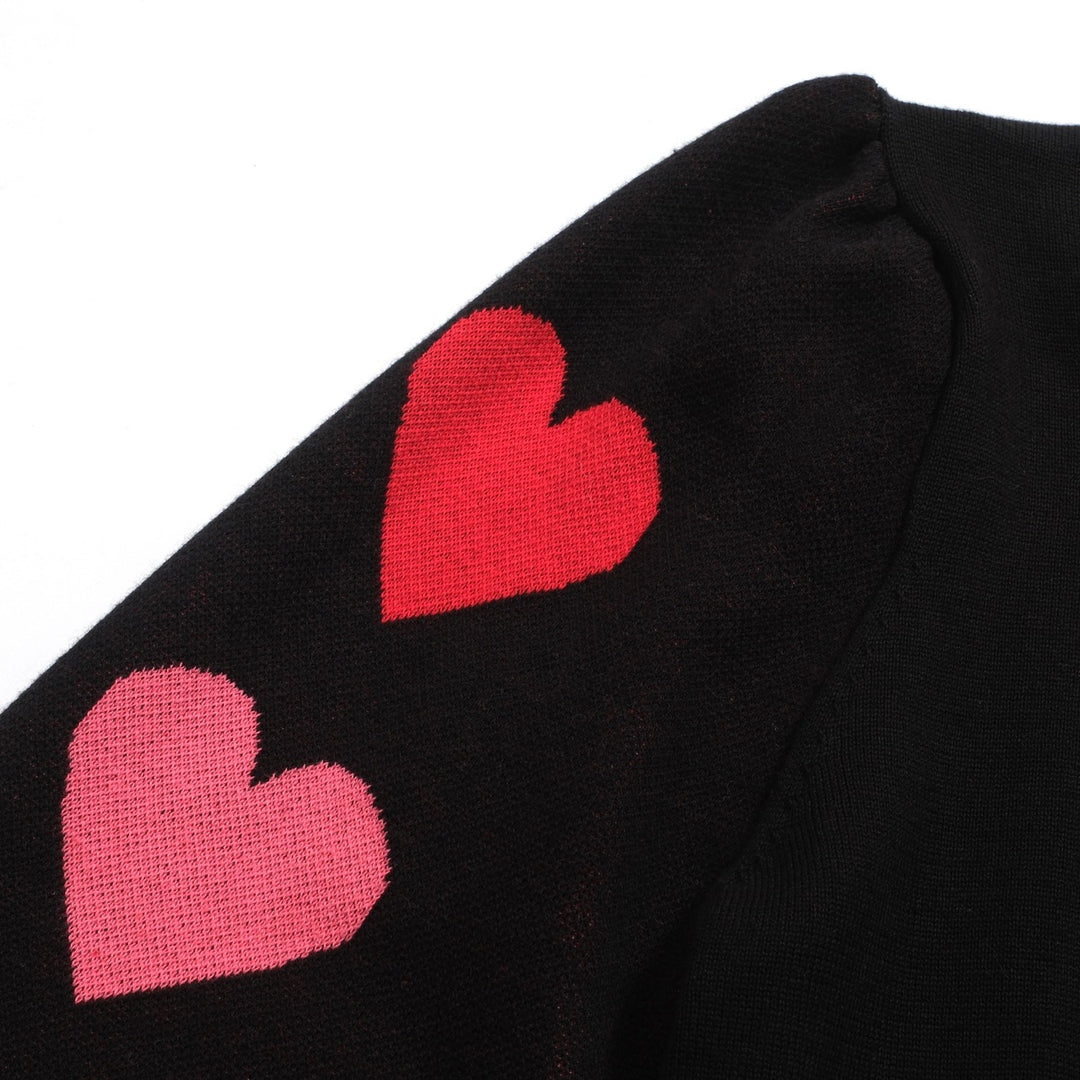 Kvinnors svarta stickade plagg i jacquard bubbelärm