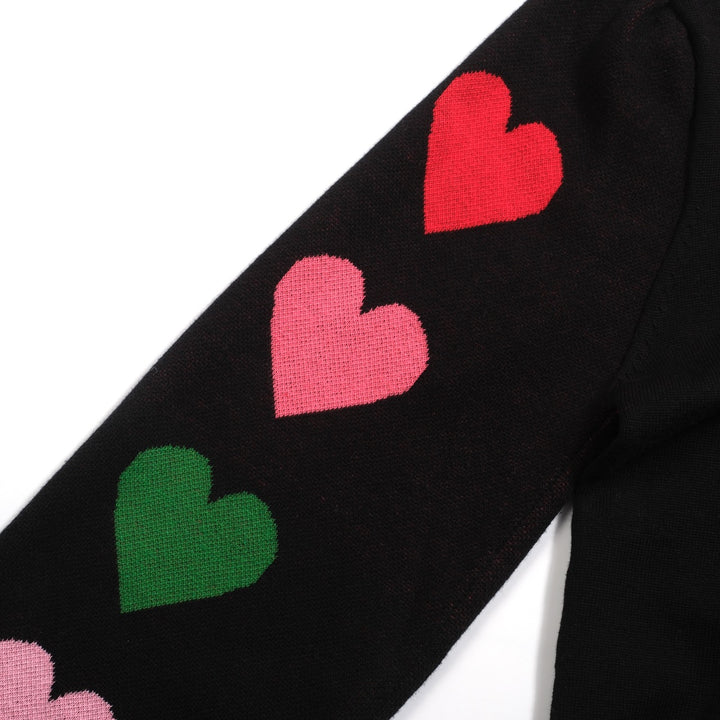 Kvinnors svarta stickade plagg i jacquard bubbelärm