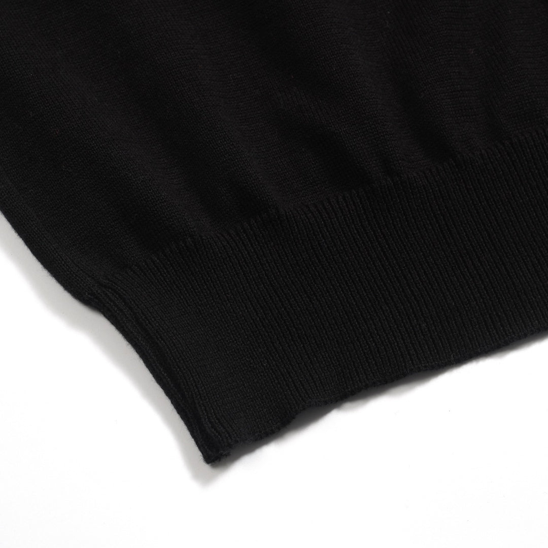 Kvinnors svarta stickade plagg i jacquard bubbelärm