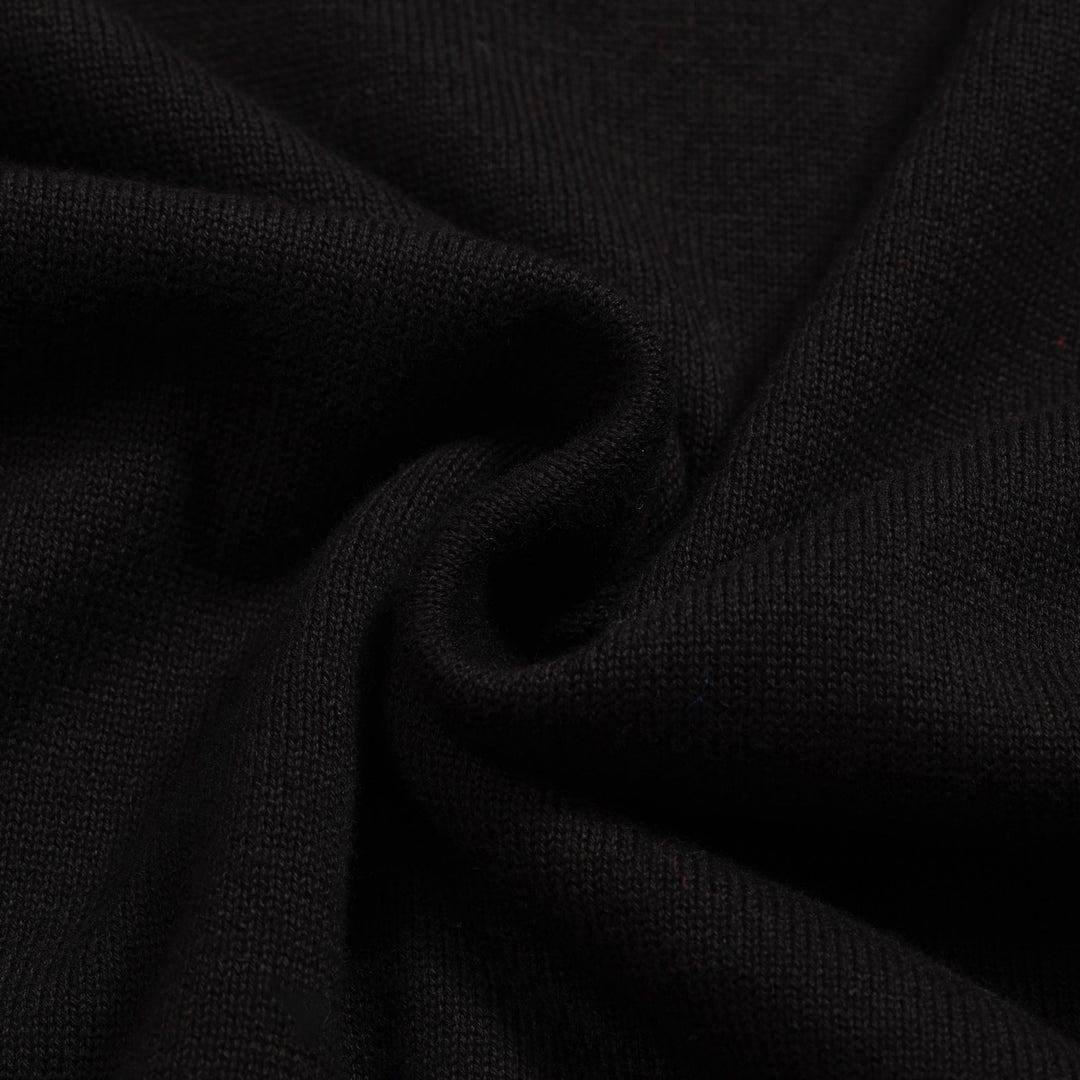 Kvinnors svarta stickade plagg i jacquard bubbelärm