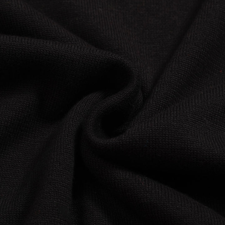 Kvinnors svarta stickade plagg i jacquard bubbelärm