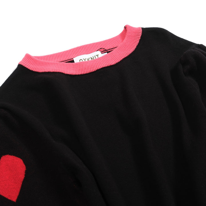 Kvinnors svarta stickade plagg i jacquard bubbelärm