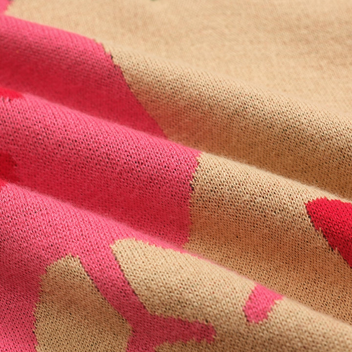 Dampikétröja med V-ringad grön djurblomma i jacquard