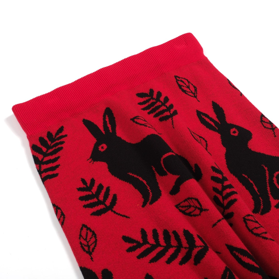 Damkjol i röda jacquardstickade djur