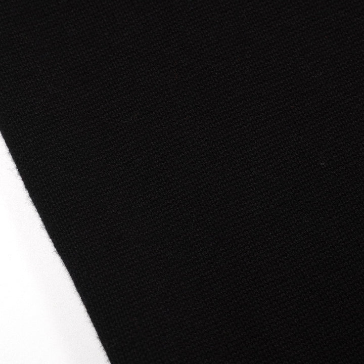 Polo da donna in maglia nera alla moda retrò street art