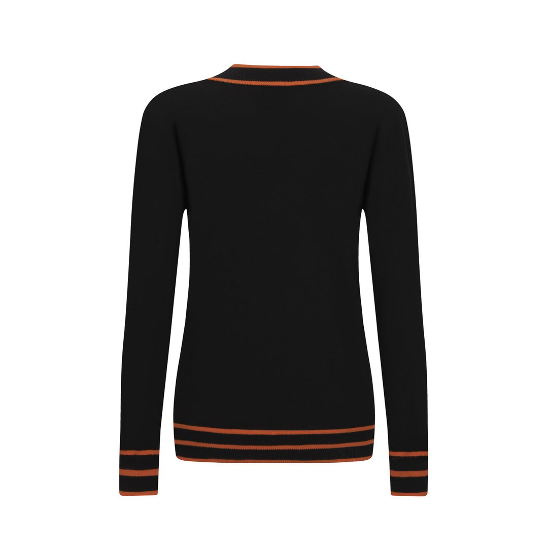 Polo da donna in maglia nera alla moda retrò street art