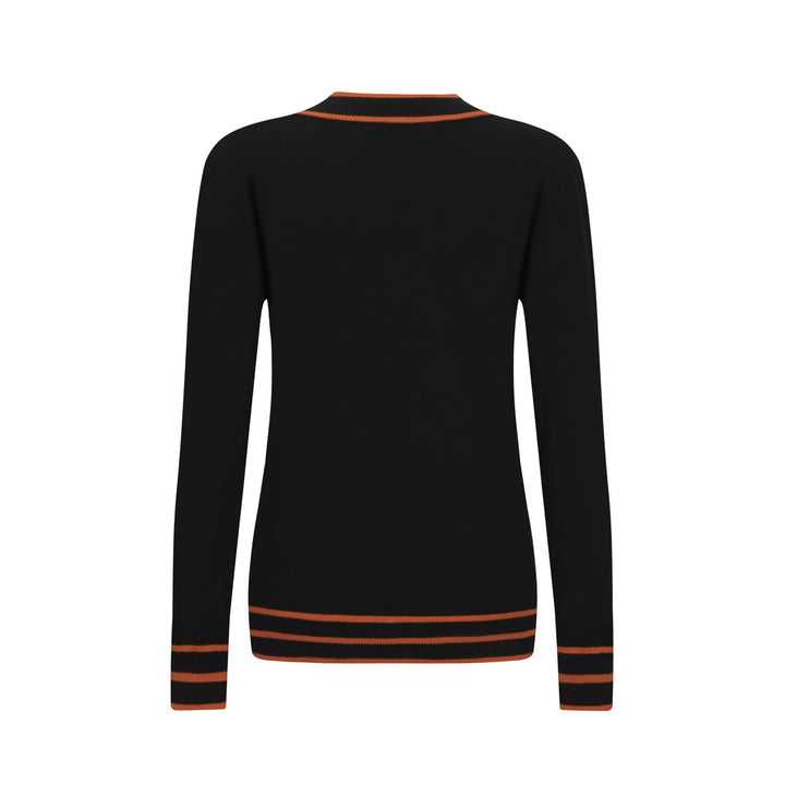 Polo da donna in maglia nera alla moda retrò street art