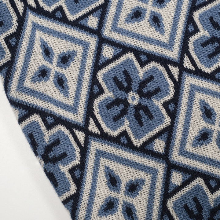 Donkerblauwe gebreide herenpolo met V-hals uit de jaren 60