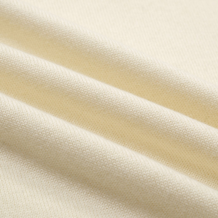 Herren apricot-weiße diamantförmige gestrickte V-Neck-Polo