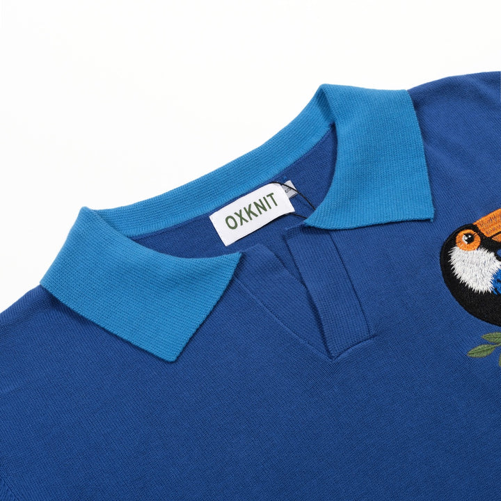 Heren blauwe vintage gebreide polo met dierenborduursel en V-hals
