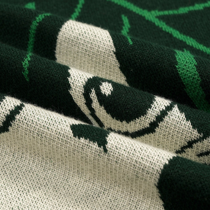 Camiseta de punto jacquard verde para mujer con ilustración tropical de gato y manga corta
