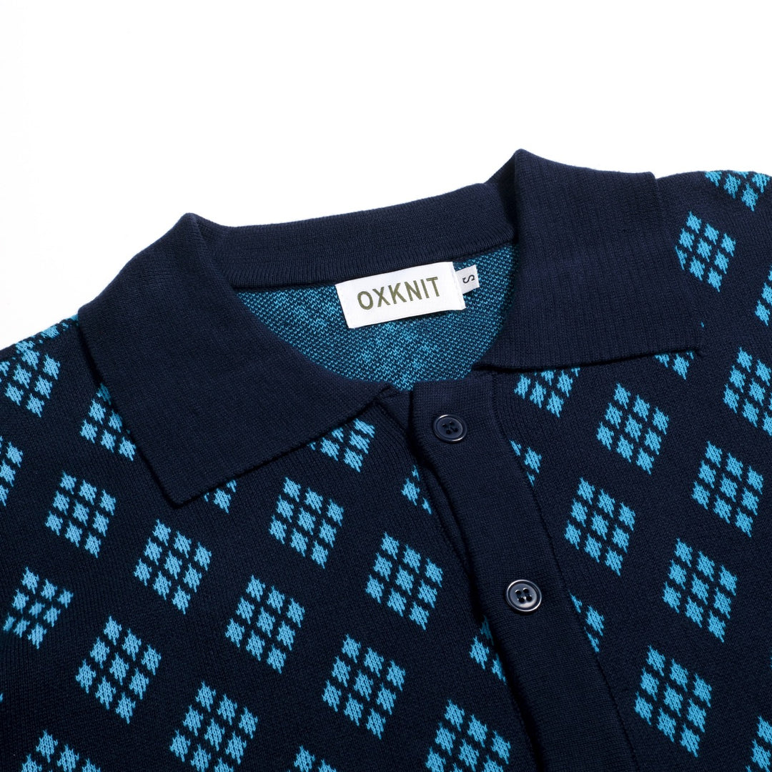 Herrarnas mörkblå 60-tals retro stickad polokofta med diamantmönster