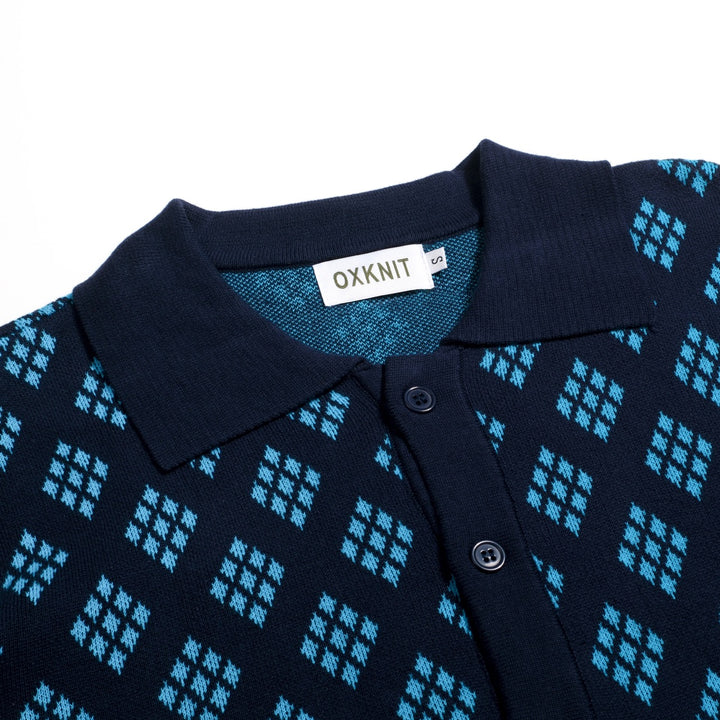 Herrarnas mörkblå 60-tals retro stickad polokofta med diamantmönster