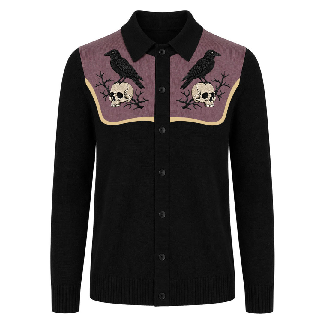 Men's black knit cardigan with embroidered black ravens and skulls on a muted mauve chest panel, black buttons and long sleeves.