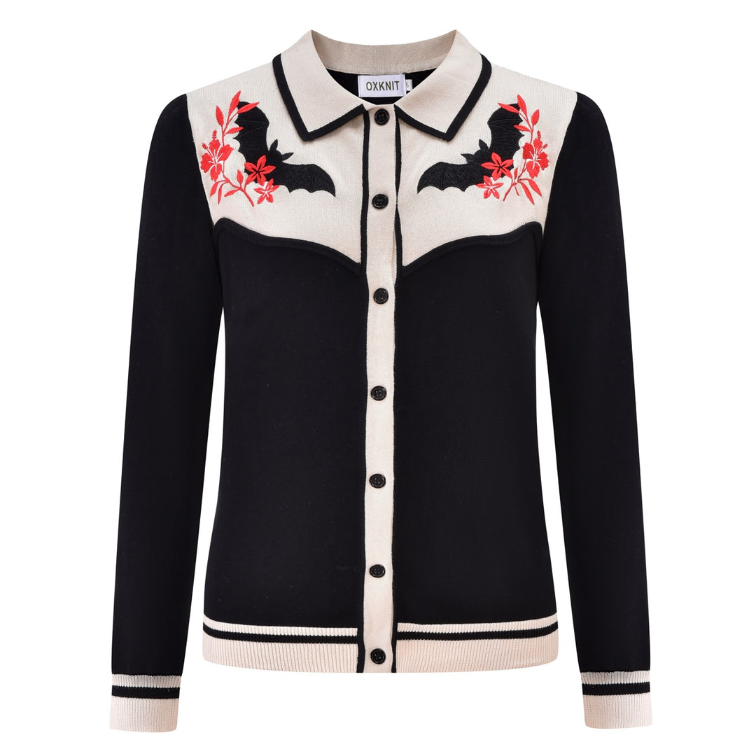Women's black knit cardigan with bat and red floral embroidery, a cream contrast collar, and button-front closure.