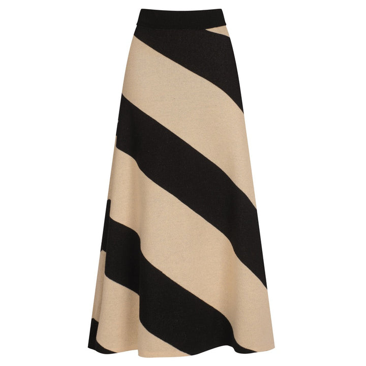 Women's black and cream knit skirt with bold diagonal abstract stripes and a jacquard pattern.