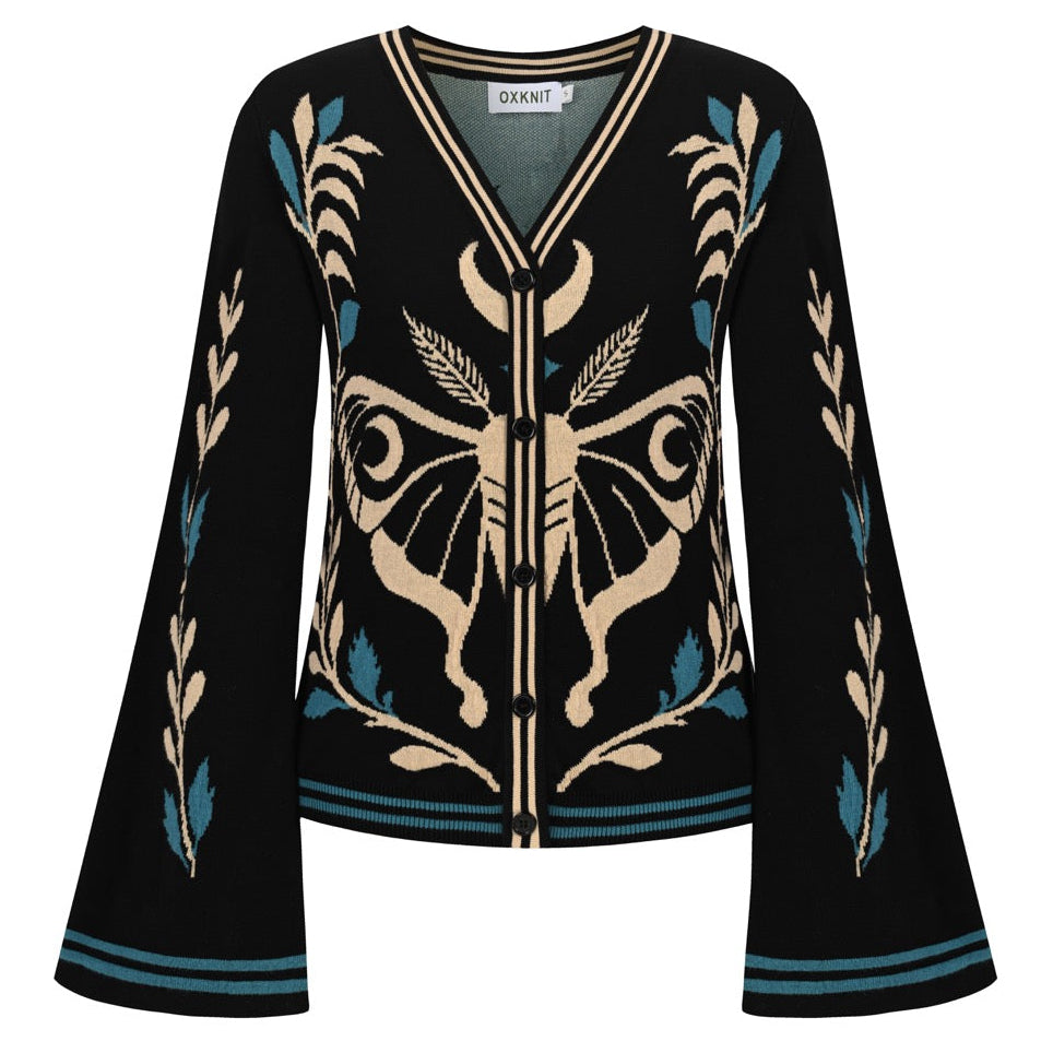 Women's black gothic moth jacquard knit cardigan with cream and teal botanical motifs, a V-neck button front, and flared sleeves.