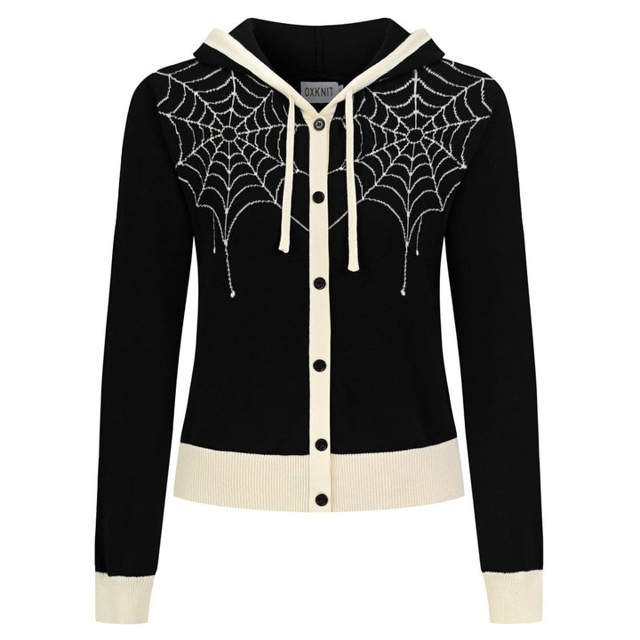 Women's black cropped hooded knit cardigan featuring cream spiderweb jacquard patterns, a button-front closure, long sleeves, and contrasting ribbed trim.