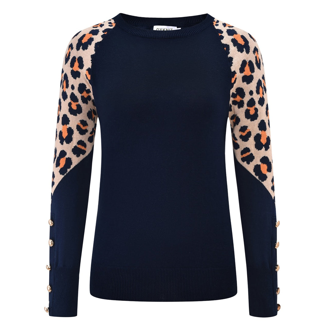 Women's navy blue knit sweater with beige and orange leopard print sleeves, decorative gold-tone side buttons, and a crew neckline.å